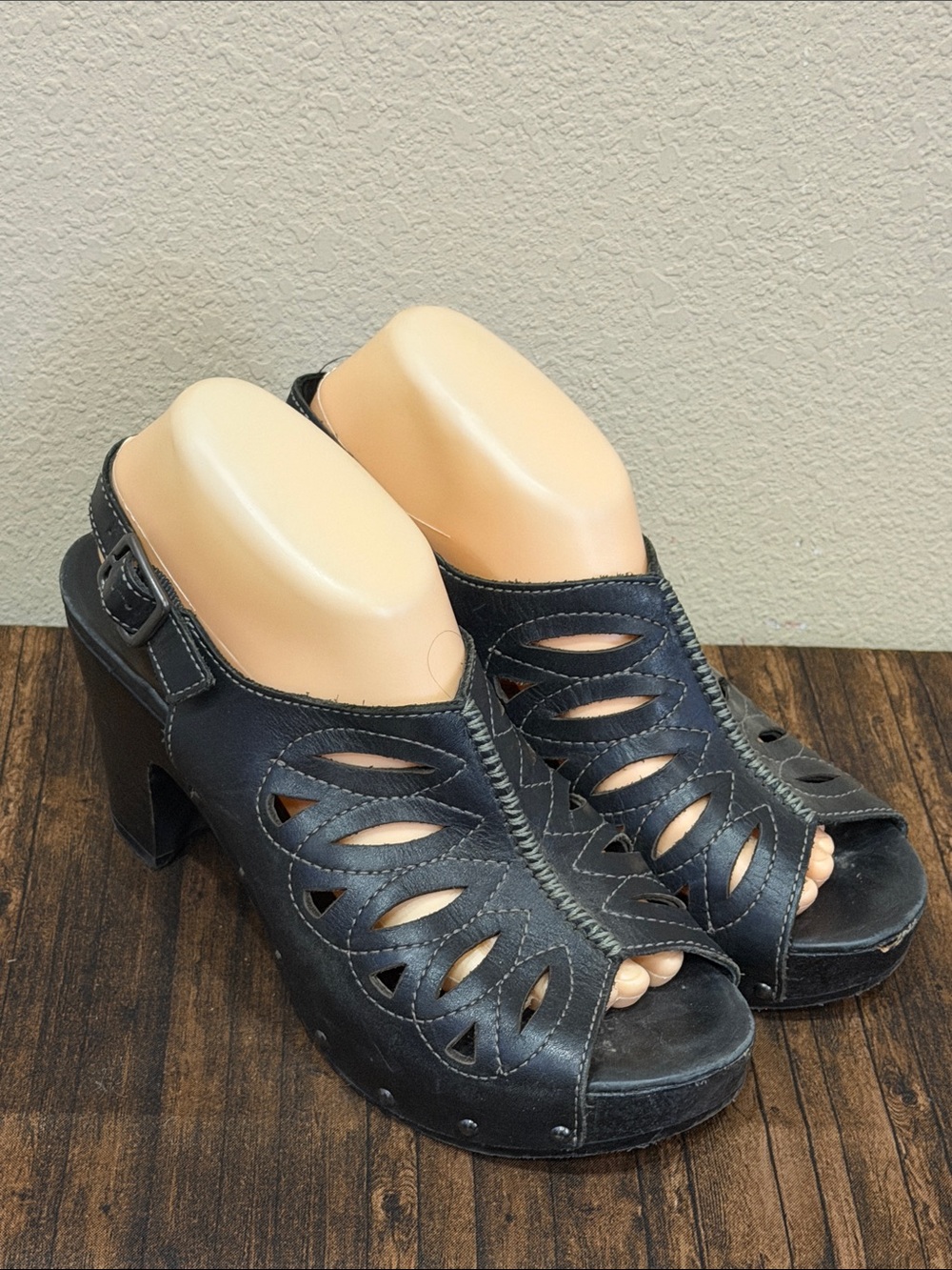 Dansko Black Leather Cutout Slingback Clogs with Studded Trim